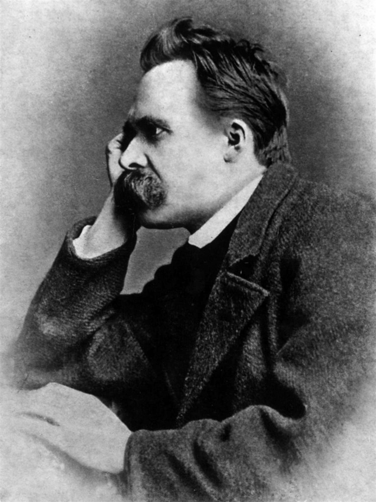 Friedrich Nietzsche resting his face on his hand, photographed by Gustav-Adolf Schultze in 1882.